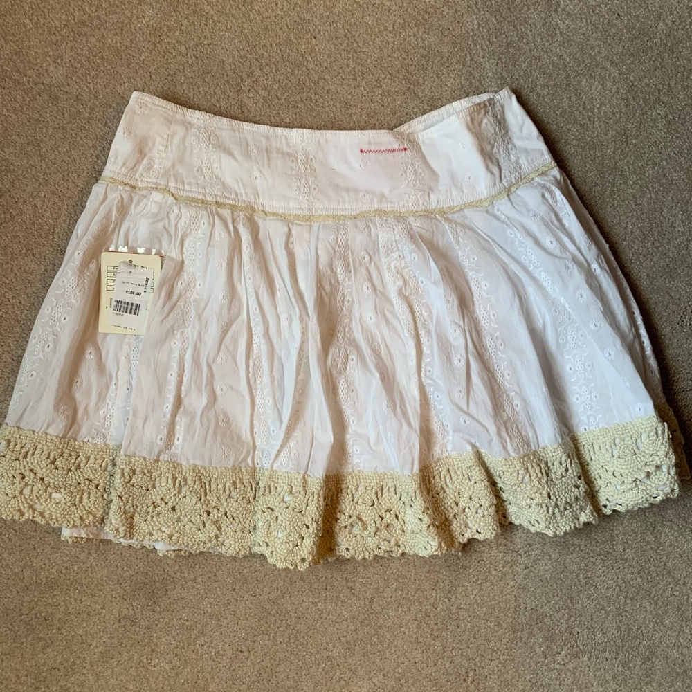 New with tags Free People wrap skirt; white with cream lace; smoke free
